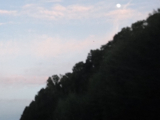 Daylight moon over the mountain